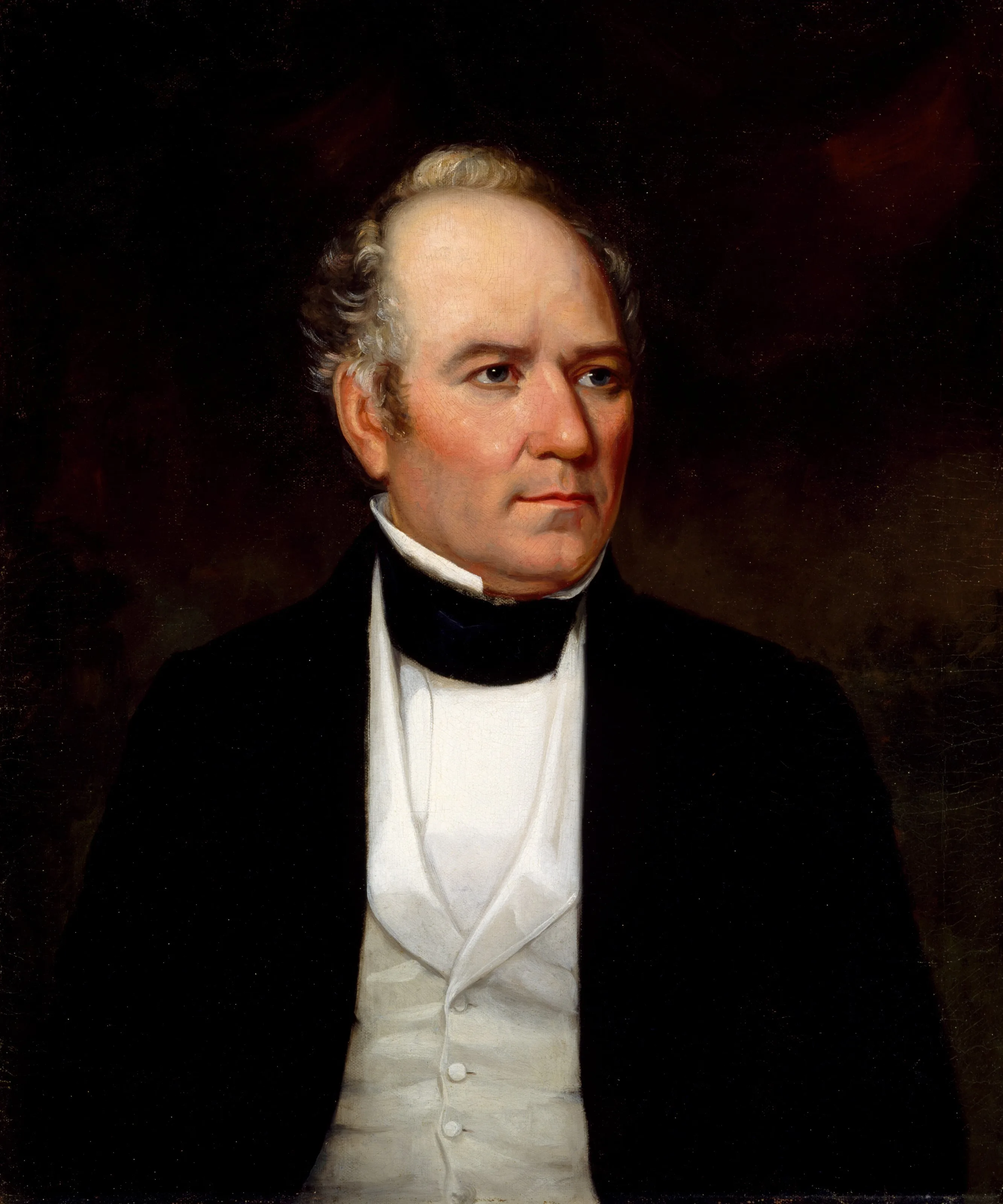 Oil portrait of Sam Houston with thinning gray hair, in a dark coat, high black stock, and white waistcoat against a dark background.