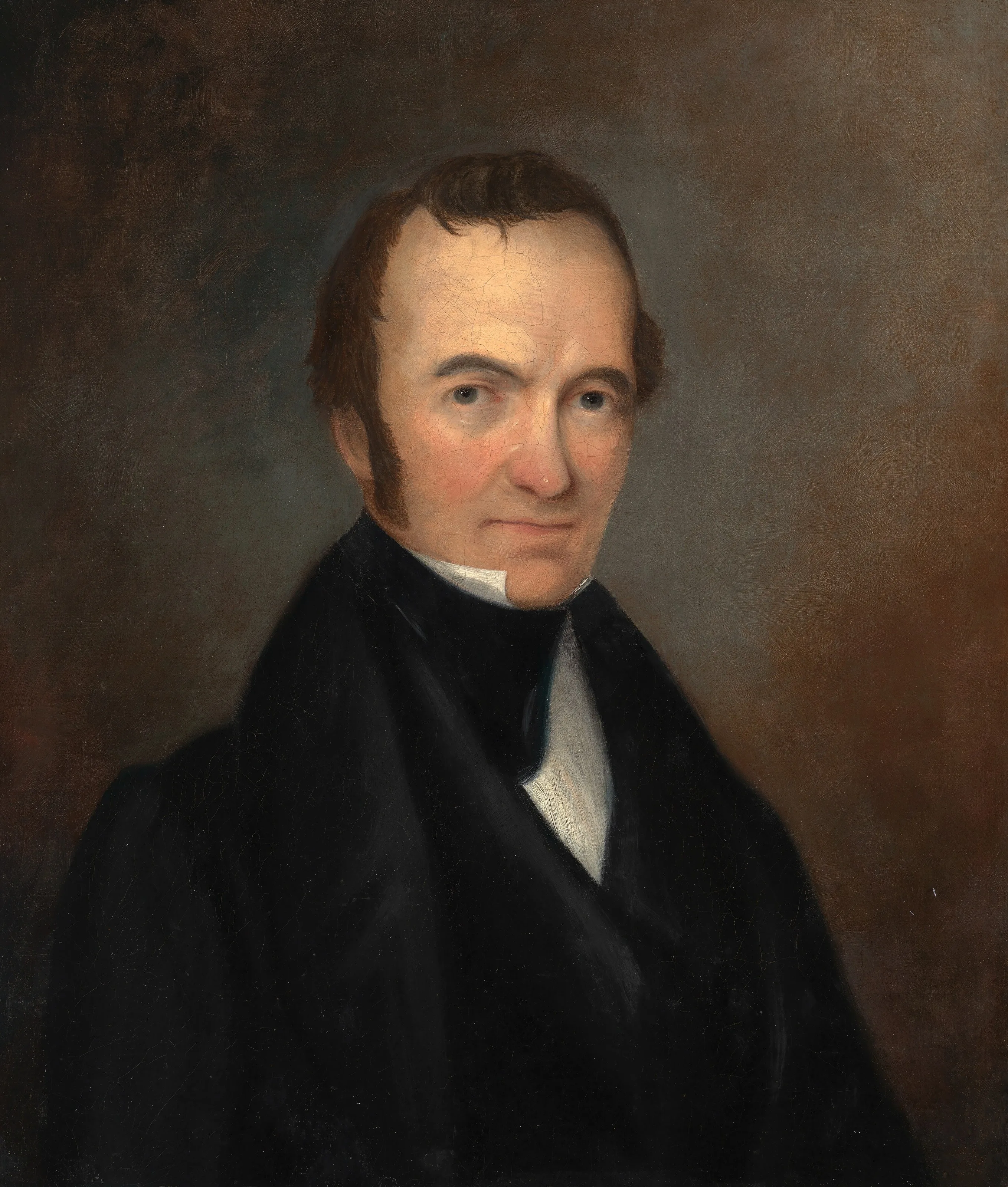 Oil portrait of Stephen F. Austin, shown from the chest up in a dark coat and white collar against a dark background.